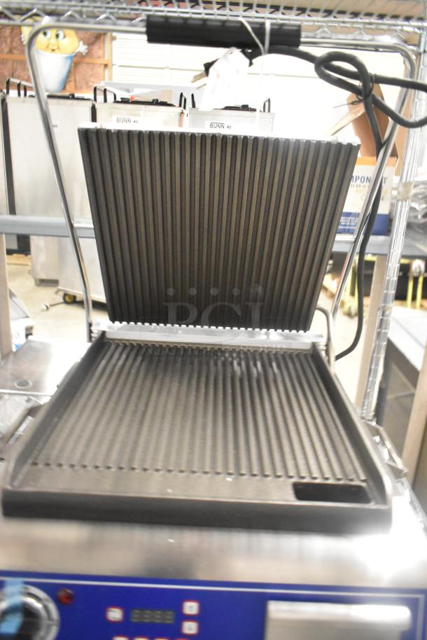 Brand new Globe GPG14D stainless steel commercial panini press, 120V, 1 Phase, with ribbed grill plates, digital controls.