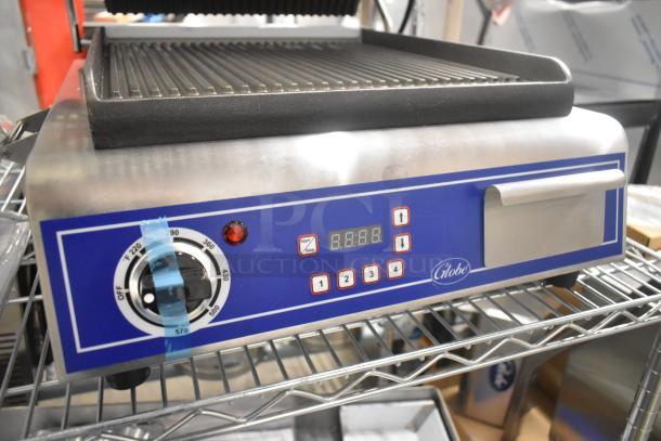 Brand new Globe C12 stainless steel commercial panini press, Model GPG14D. Features digital controls and timer. 120V, 1 phase.