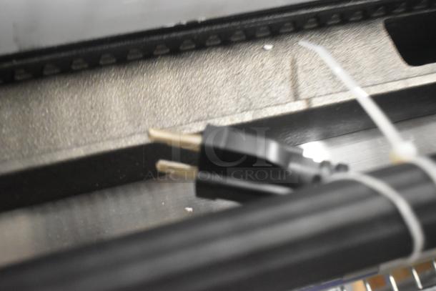 Brand new Globe C12 stainless steel commercial panini press, model GPG14D, 120V, 1 phase, shown with power cord.