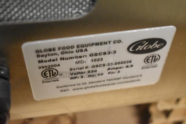 Brand new Globe GSCS3-3 electric cheese shredder. 230V, 3 Phase, 65 lb/min capacity. ETL-certified tag shown.