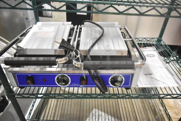 BRAND NEW 2024 Globe GSGDUE10 stainless steel double panini press, 240V, with control knobs, labeled ON switch.