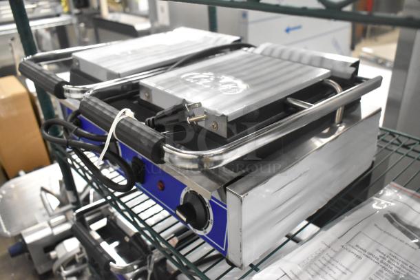 Brand new 2024 Globe GSGDUE10 stainless steel double panini press, 240 volts, 1 phase, with protective packaging.