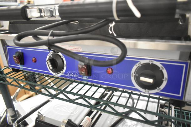 Brand new 2024 Globe GSGDUE10 stainless steel double panini press, 240V, 1 phase. Temperature dials, on/off switches visible.
