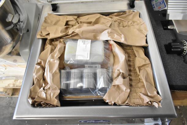 Brand new 2023 Globe GVP20 stainless steel commercial vacuum sealer with 16.5" seal bar in packaging.