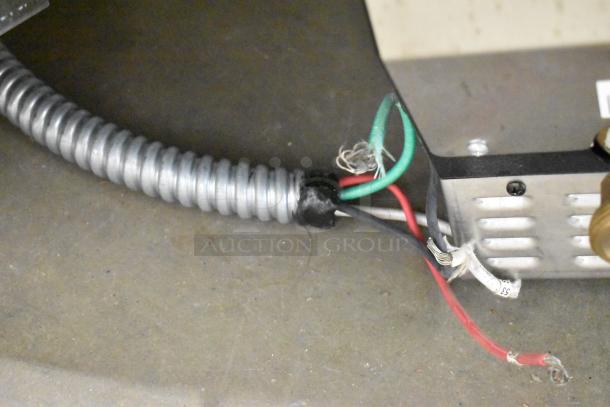 Hatco HCWBIR-3DA stainless steel food well wiring detail, showing coiled conduit and electrical connections.