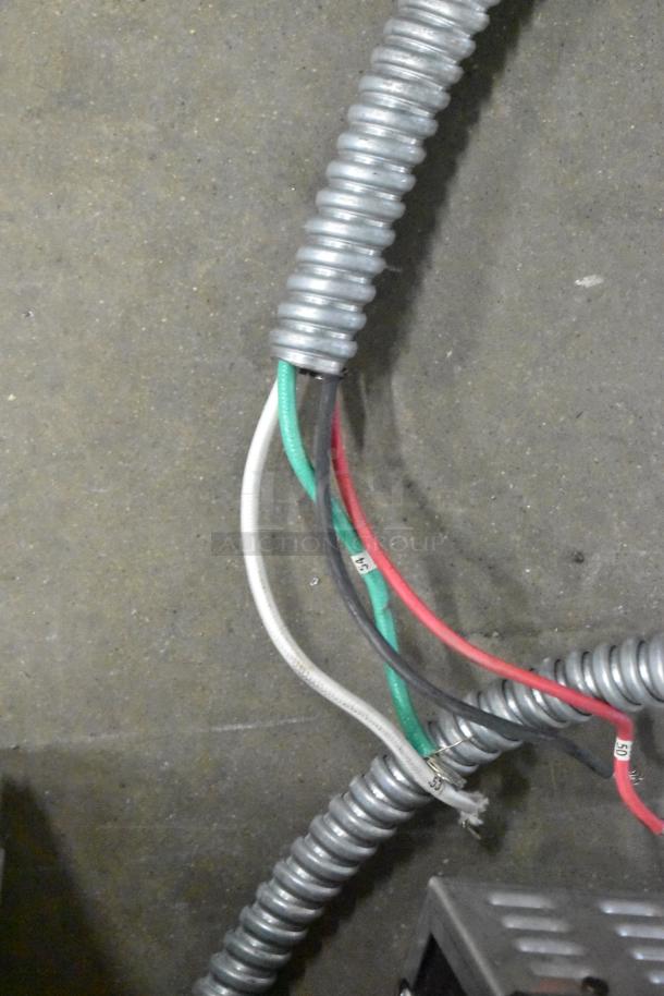 Coiled electric cables for Hatco HCWBIR-3DA food well. Red, black, white, green wires visible in protective conduit.