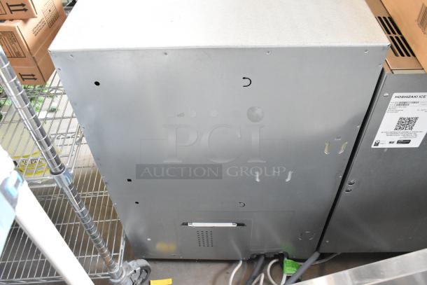 FP Metal Unit, 110-120 Volts, 1 Phase. Silver casing, vented panel, visible wiring. Good condition. Suitable for industrial use.