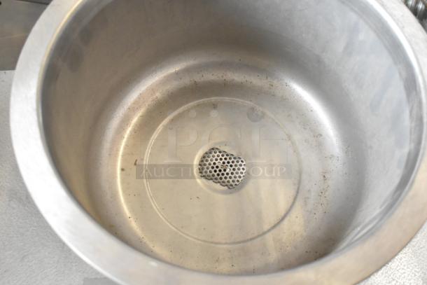 Wells metal commercial round drop-in food warmer, 120 volts, 1 phase, showing some wear, perforated drain at base.