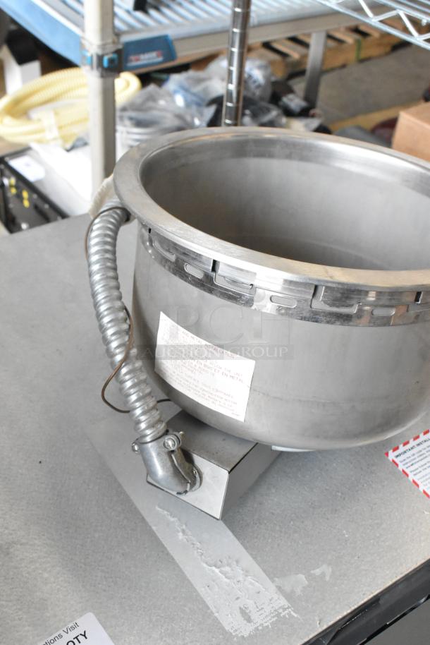 Wells metal commercial round drop-in food warmer, stainless steel, 120 volts, 1 phase, visible safety and installation labels.
