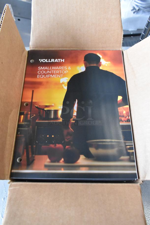3 brand new Vollrath booklets in an open box. Front cover reads "Smallwares & Countertop Equipment."