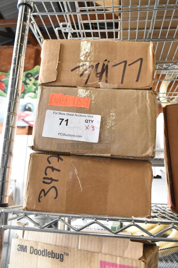 Three brand new boxes of Vollrath booklets, labeled "71 QTY X 3," on a shelf. Perfect condition, ready for auction.