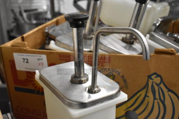 9 white poly bins with stainless steel pump lids, auction quantity 9. Visible sign: "Lot 72, QTY x9."