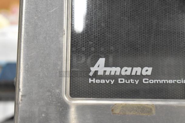 Amana HDC10 commercial microwave oven, stainless steel, 120 volts, 1 phase, "Heavy Duty Commercial" label visible.