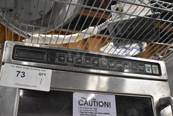 Amana HDC10 stainless steel commercial countertop microwave oven, digital controls, 120 volts, 1 phase, auction tag visible.