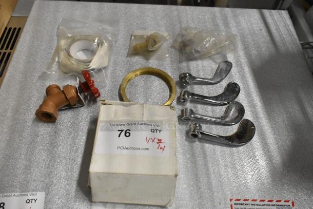 Lot of various items including four chrome handles, brass ring, pipe fittings, tape roll, and box labeled "76."