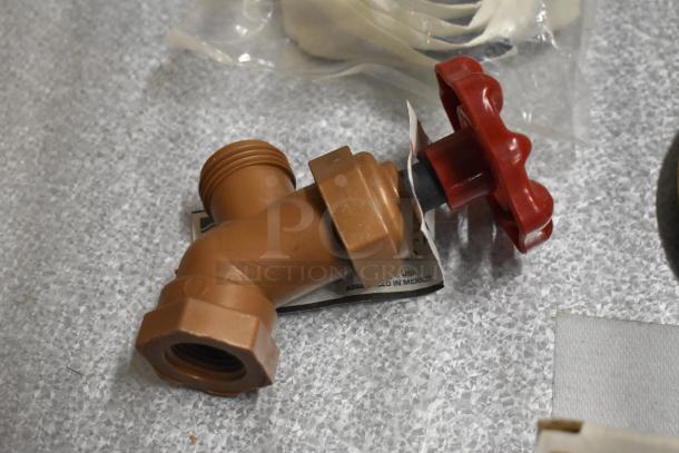 Lot includes a brown plastic pipe fitting with a red handwheel, tag showing assembly in Mexico, in good condition.