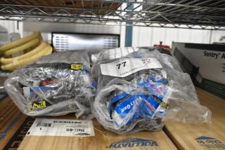 Bagged assorted items including gloves and accessories. Labels display "10-XL," "Arctic," "Grip," and "Qty 3."