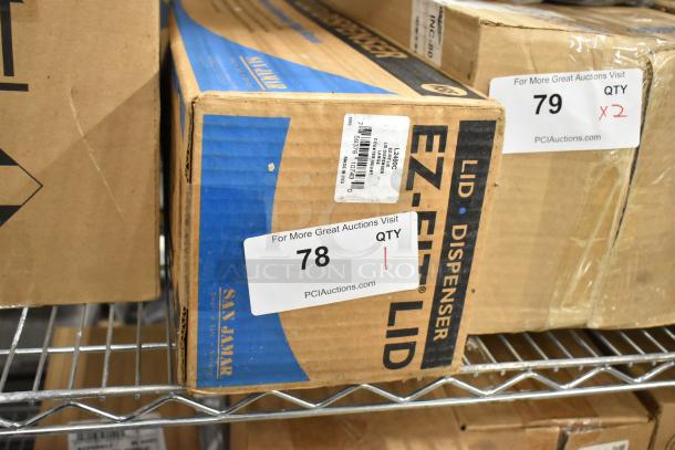 Brand new San Jamar EZ-FIT LID Dispenser in original box, item #78. Packaging intact, ready for use.