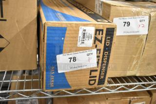 Brand new San Jamar EZ-FIT LID Dispenser in original box, item #78. Packaging intact, ready for use.
