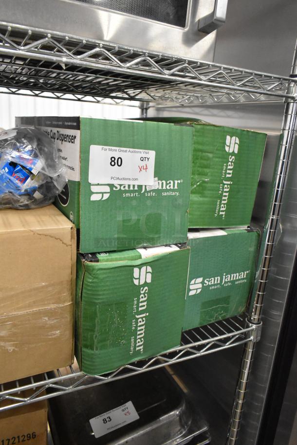 Four new San Jamar C5450C in-counter adjustable cup dispensers in boxes on a shelf, labeled "80 QTY x4."