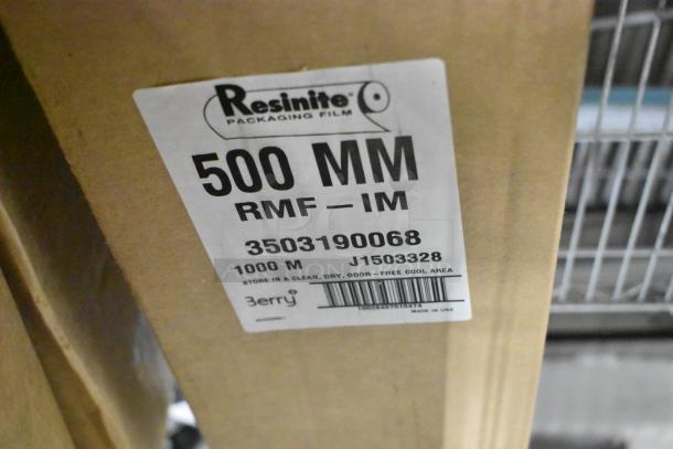 7 brand new boxes of Resinite 500mm RMF-IM meat packaging film, 1000m each, label shows model number and storage instructions.