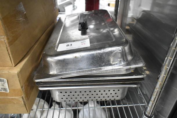 Five metal kitchen items including a perforated steam pan and chafer lids, visible auction label reads "83, QTY x5".