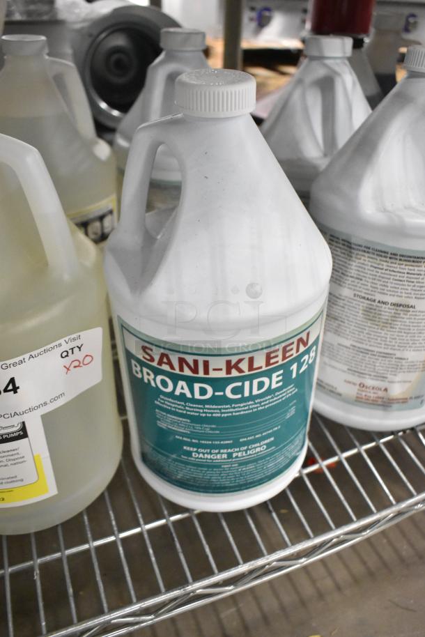 Alt text: "20 jugs of cleaner, including Sani-Kleen Broad-cide 128 and Neutral Clean Floor Cleanser on metal shelf."