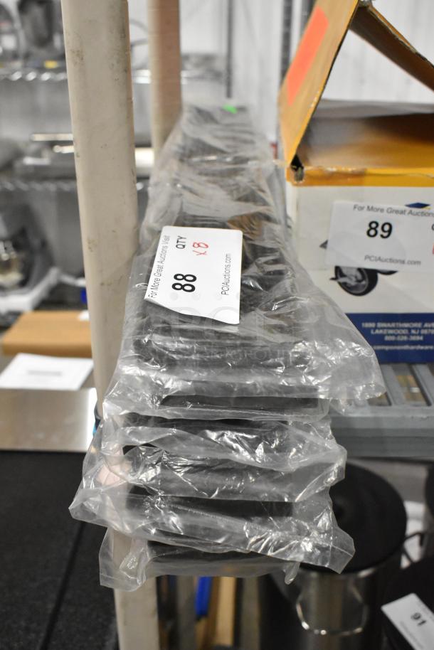 Eight brand new Tablecraft 753BR 27"L brown bar mats in original packaging, ready for auction. Tags indicate quantity and auction details.