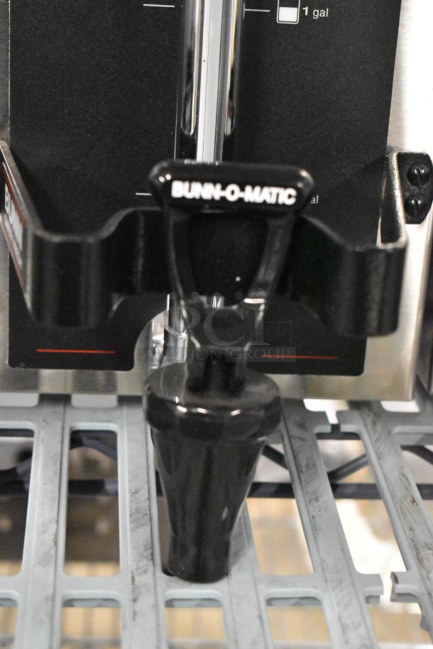 Brand new Bunn 1.5GPR-FF coffee server with fast flow faucet. Features top handles and Bunn-O-Matic branding.