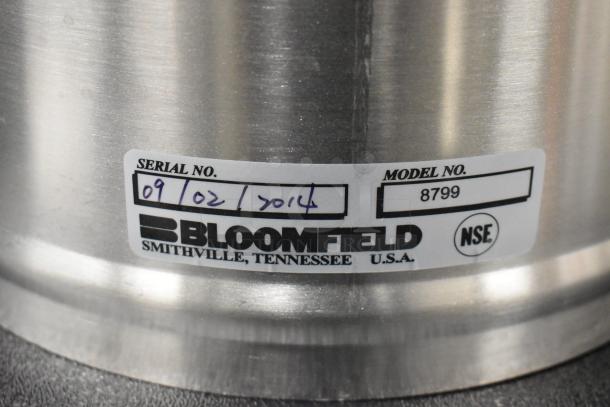 Bloomfield stainless steel iced tea dispenser, model 8799, brand new, serial number 0910217014, made in USA.