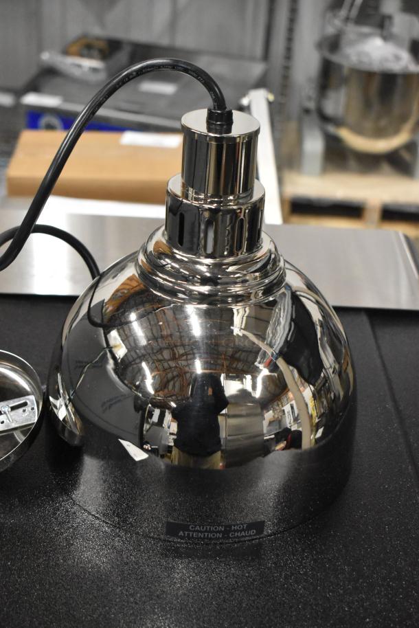 Hatco DL-725-CN metal heat lamp, brand new, 120 volts, 1 phase. Shiny surface with "Caution Hot" label.