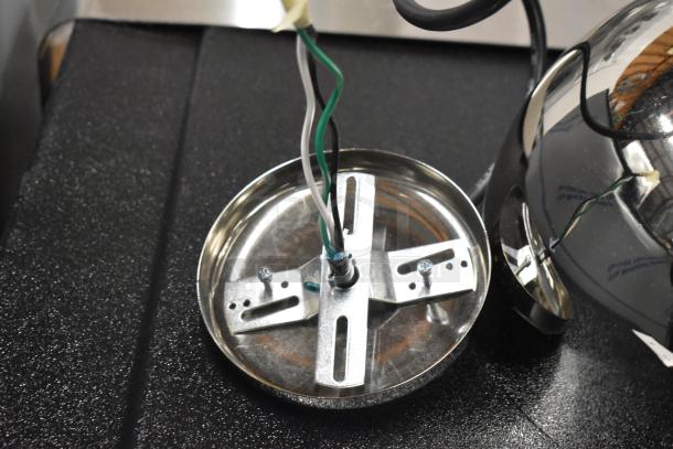 Brand new Hatco DL-725-CN metal heat lamp, 120 volts, 1 phase, with wiring and mounting hardware visible.