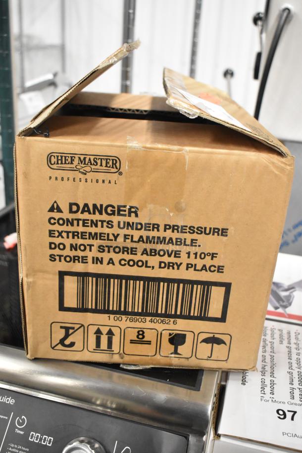 Box of 12 ChefMaster Butane Fuel Bottles, brand new. Safety warnings indicate flammable contents. Box is sealed and intact.