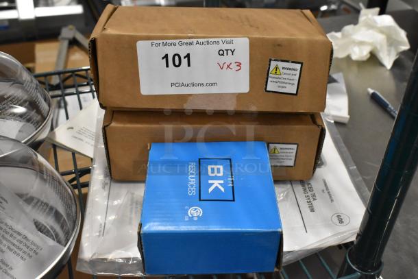 Three new items, including BK BKD-8-G deck mount faucet, in original packaging with warning labels visible.