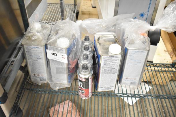 8 new items including ChefMaster Butane can and Sheila Shine Polish cans. Auction tag reads "103 QTY X8."