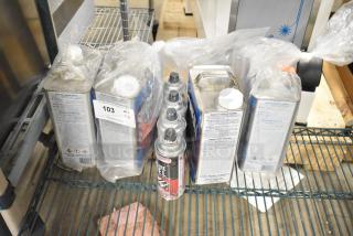 8 new items including ChefMaster Butane can and Sheila Shine Polish cans. Auction tag reads "103 QTY X8."