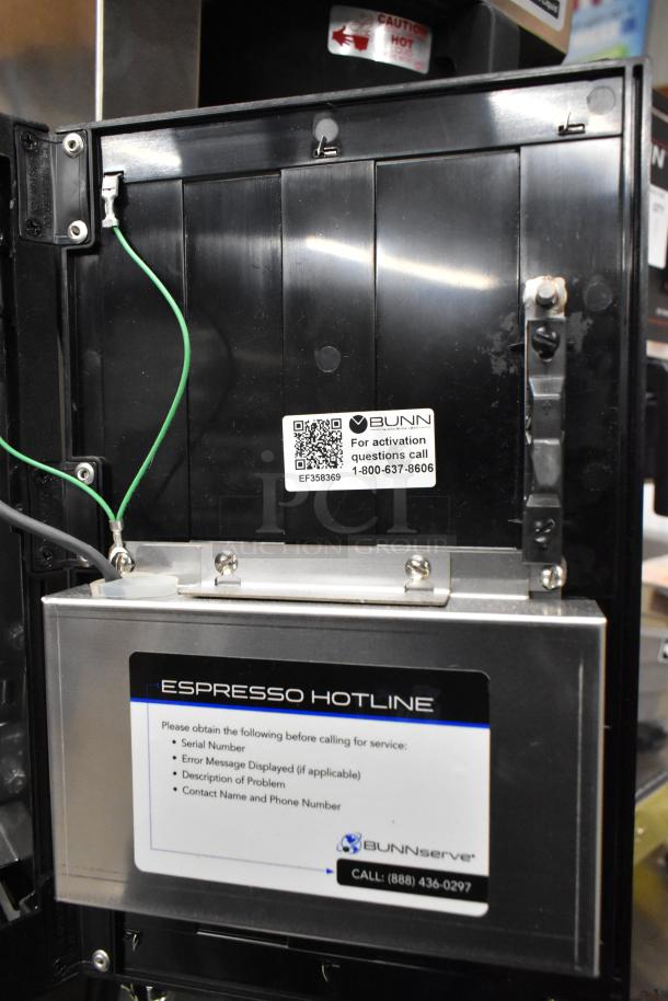 BRAND NEW Bunn stainless steel commercial espresso machine with hot water dispenser, activation info visible.