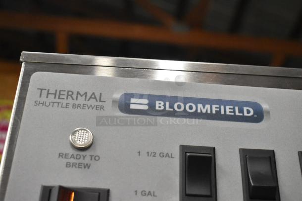 Bloomfield 8795 iced tea machine, stainless steel, new condition. Features hot water dispenser, 120/240 volts, 1 phase.