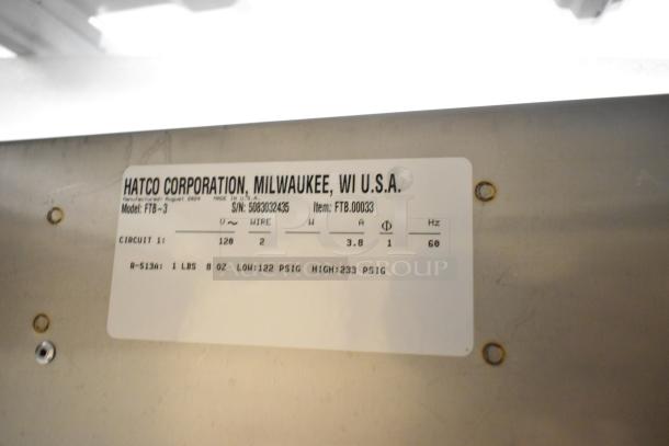Stainless steel Hatco FTB-3 frost top tag, showing model, voltage, phase details, and serial number. Brand new condition.
