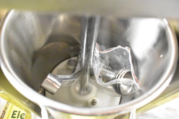 Brand new Avantco SS-20V 20 lb. stainless steel vertical sausage stuffer with multiple stainless steel funnels visible inside.