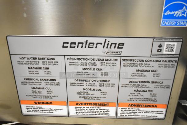 Brand new 2025 Hobart Centerline CUH-1 stainless steel undercounter dishwasher. High temp, 208-240V, 1 Phase. Label details sanitization settings.