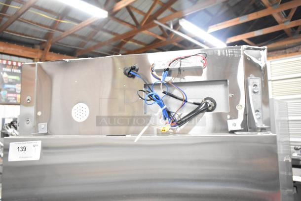 Brand new Mainstreet 829BMR23F stainless steel reach-in freezer, single door, poly coated racks, visible wiring, on casters, 115V, 1 phase.