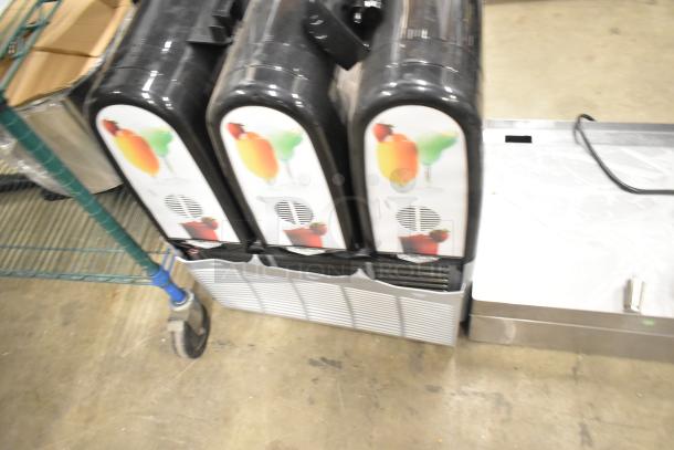 Brand new Vollrath VCBF168-37 stainless steel frozen beverage machine, triple 2.6-gallon capacity, 115 volts, minor scratches.