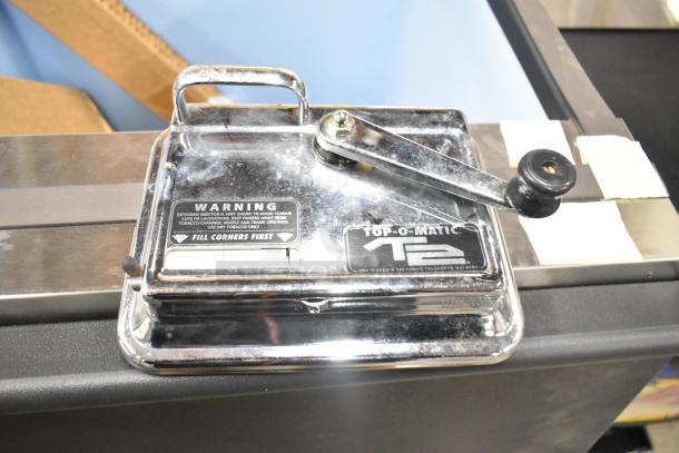 Top-O-Matic cigarette machine with chrome finish, visible warning label, and lever handle. Good condition.