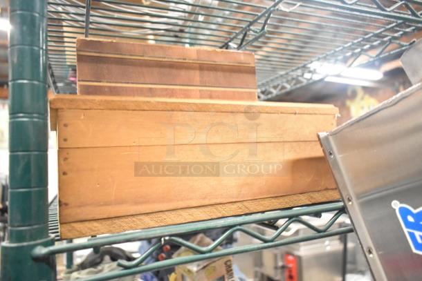 Auction tier lot featuring wooden boxes and shelving. Item condition appears used.