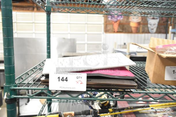 Asus laptop with white keyboard and pink case, auction tag marked "144 QTY x2".