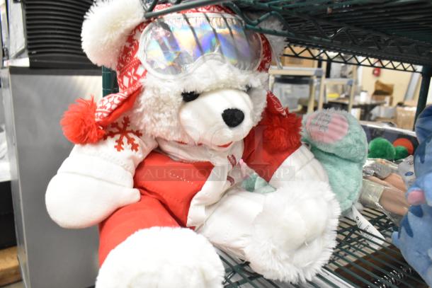 6 stuffed animals, including a white bear in winter attire, plush Stitch, Angel in costume, Oscar the Grouch, and a doll.