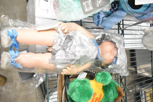 6 stuffed animals and dolls, including white bear, Stitch, Angel in green costume, Oscar the Grouch, and a doll in silver outfit.