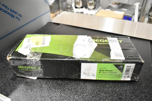 Brand new Regency wall mount faucet, model 600FW84G, with 3 1/2" swivel gooseneck spout, 8" centers. Box shows minor wear.