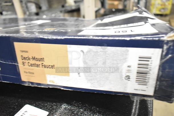 Brand new Waterloo 750PRD8X 1.15 GPM deck-mounted pre-rinse faucet with 8" centers, in scratched packaging.